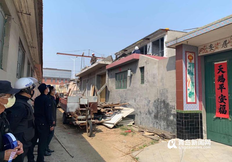 樓村統建樓不遠處的一個告示牌顯示